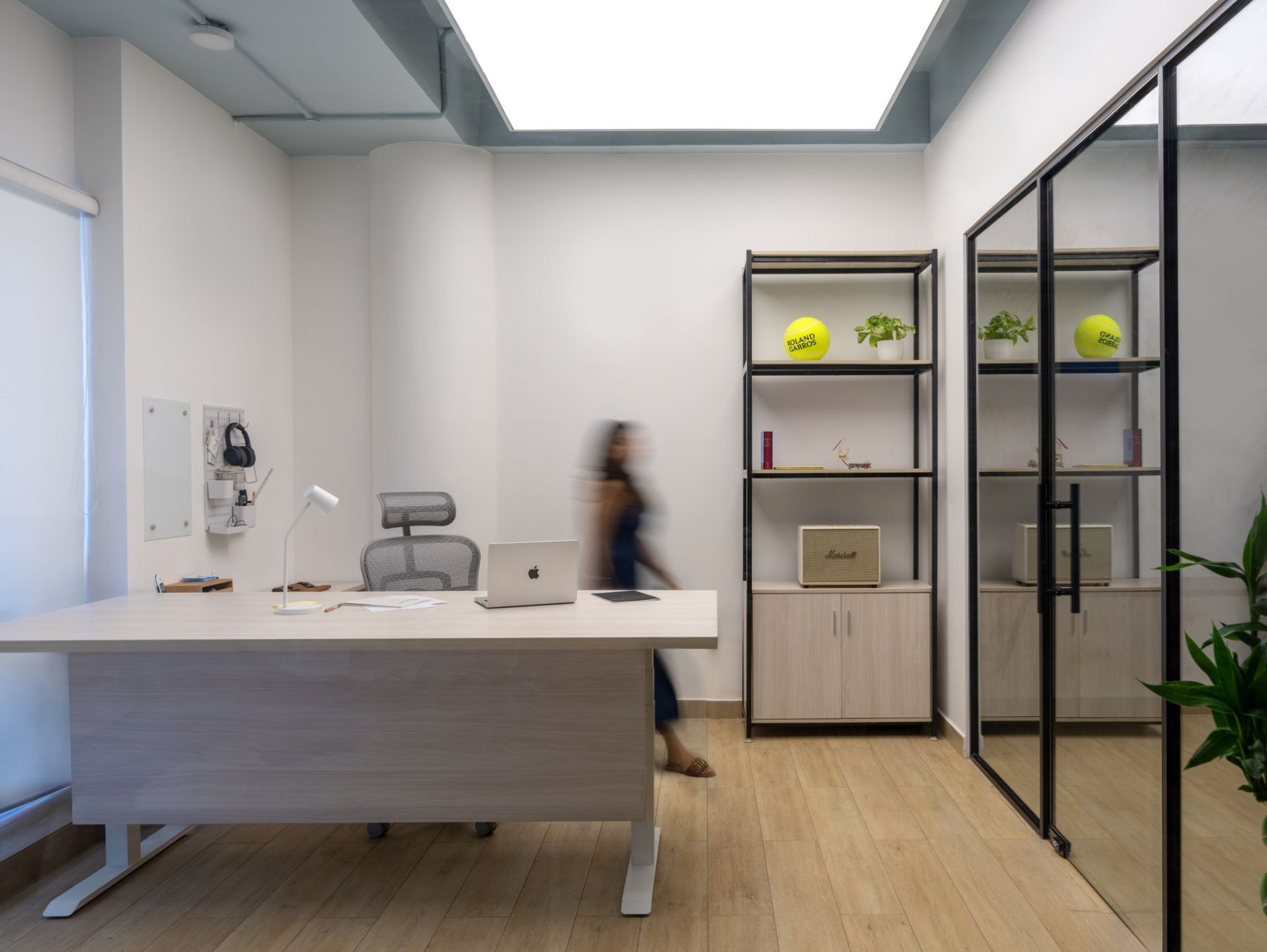 A partner cabin with a standing desk