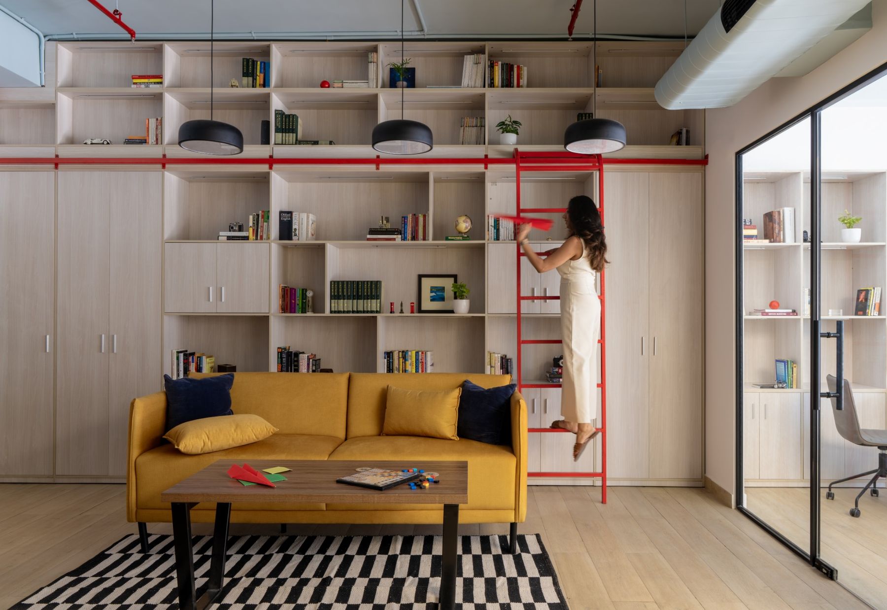 The library, with its red ladder and reading sofa