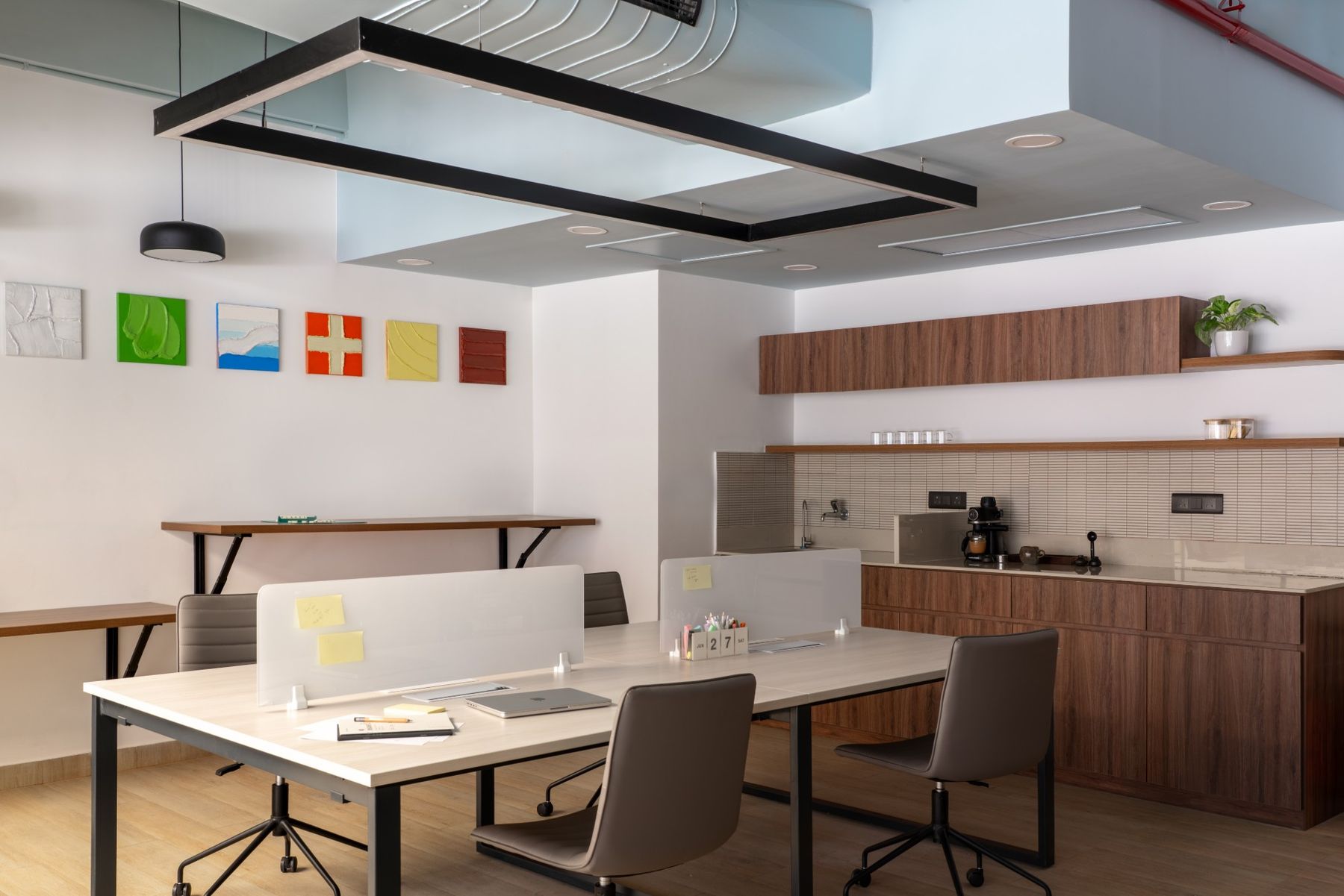 Team desks beside the pantry